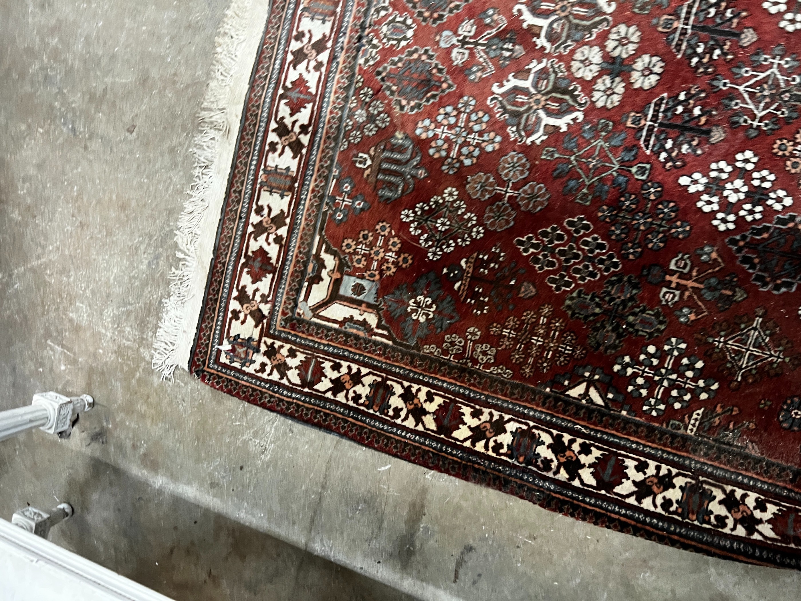 A North West Persian red ground rug, 170 x 116cm